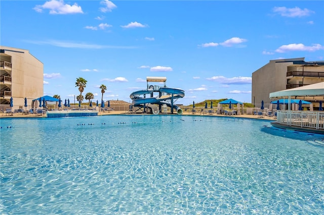 view of pool with a water slide