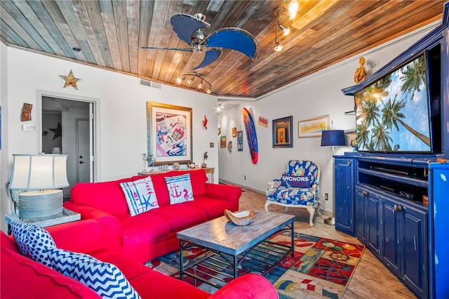 living room featuring light hardwood / wood-style floors, ceiling fan, wood ceiling, and crown molding