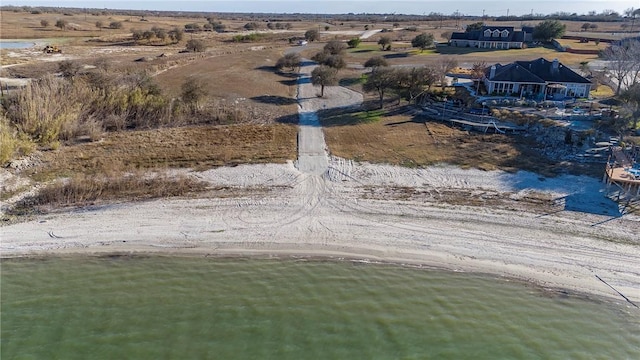 bird's eye view featuring a water view and a rural view