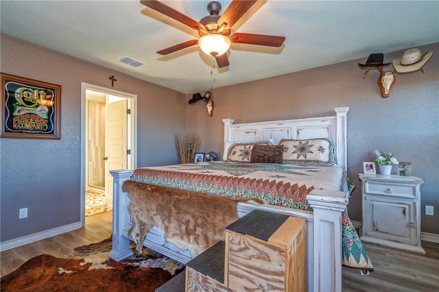 bedroom featuring hardwood / wood-style flooring and ceiling fan