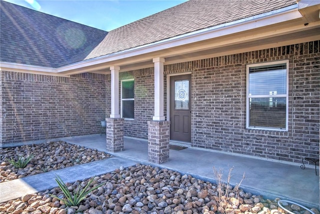 property entrance with covered porch