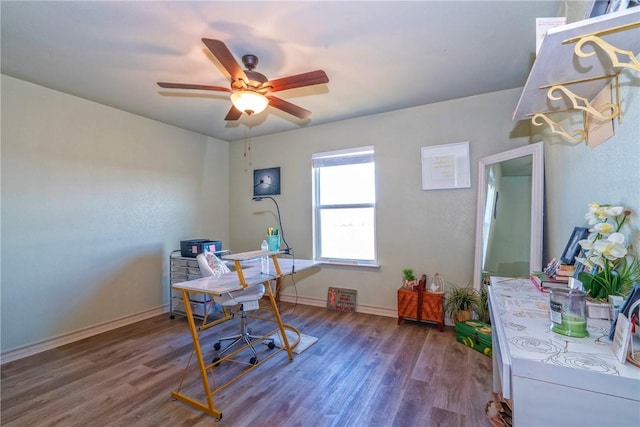 office space featuring dark wood-type flooring and ceiling fan