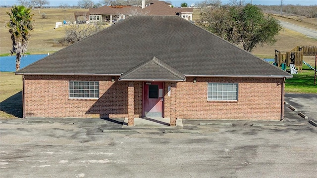 view of front of home featuring a playground