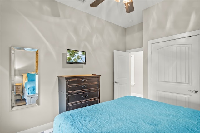 bedroom featuring ceiling fan and a closet