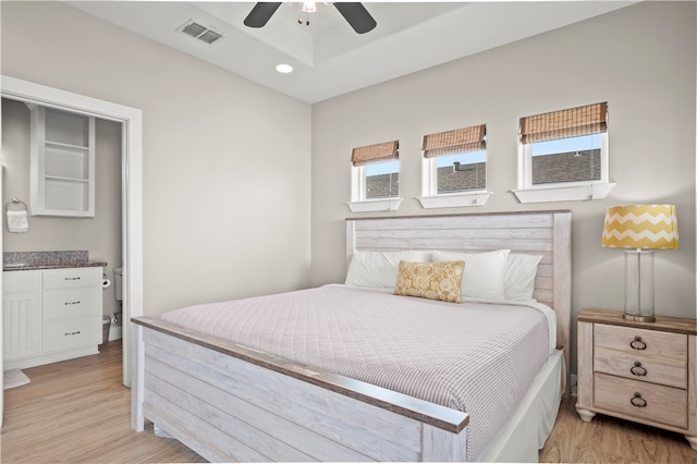 bedroom with light hardwood / wood-style flooring and ceiling fan