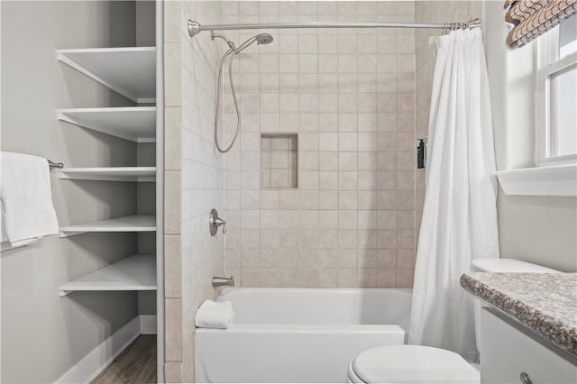 full bathroom with vanity, wood-type flooring, shower / tub combo, and toilet