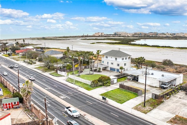 birds eye view of property with a water view