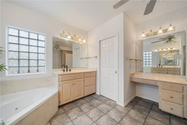 bathroom with ceiling fan, vanity, and a tub