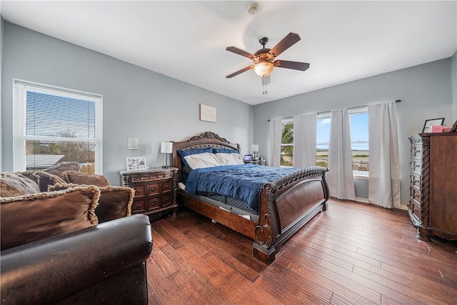 bedroom featuring ceiling fan and dark hardwood / wood-style flooring