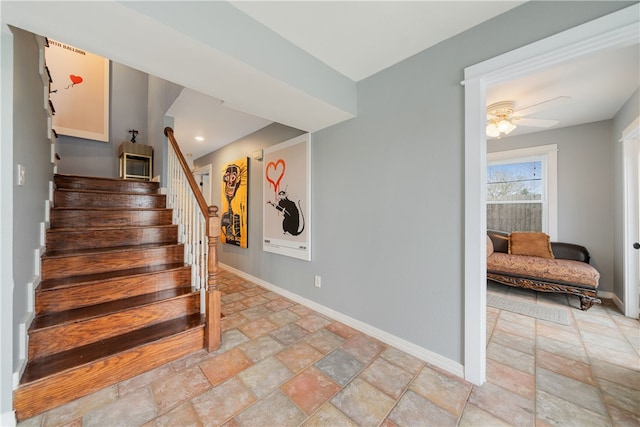 staircase with ceiling fan