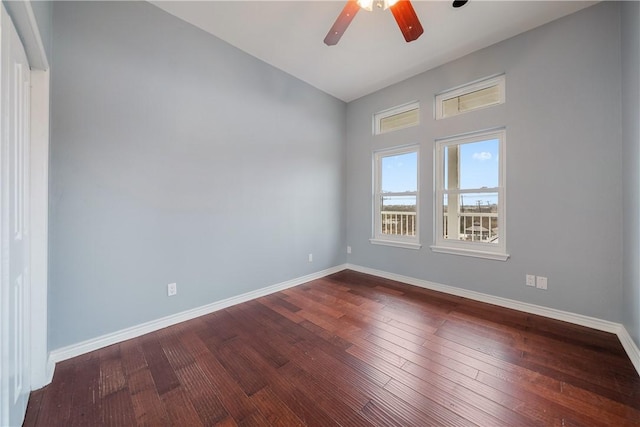 empty room featuring hardwood / wood-style flooring, lofted ceiling, and ceiling fan