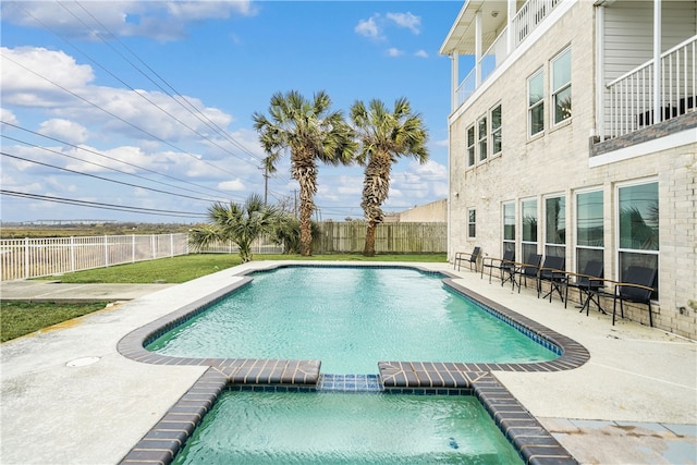 view of pool featuring a patio