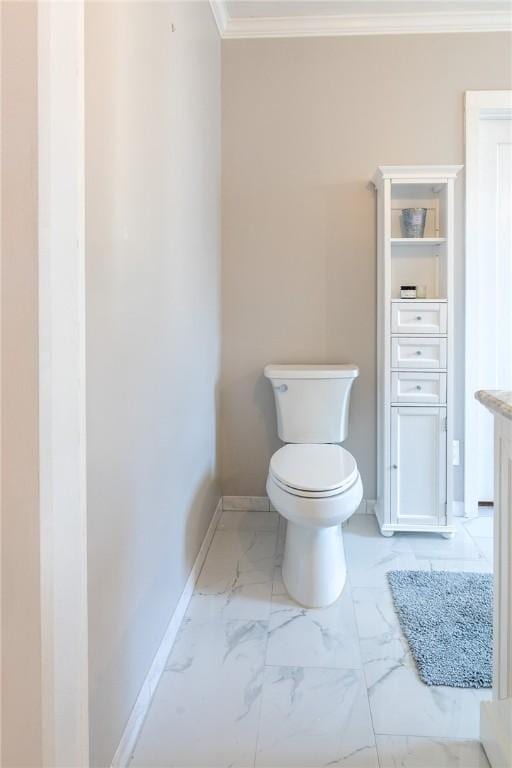 1107 N Adams St, Beeville, TX 78102 - bathroom featuring toilet, crown molding, marble look tile flooring, baseboards, and vanity
