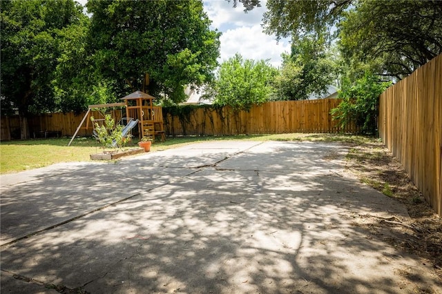 1107 N Adams St, Beeville, TX 78102 - view of patio with a playground