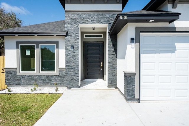 entrance to property with stucco siding, stone siding, and roof with shingles