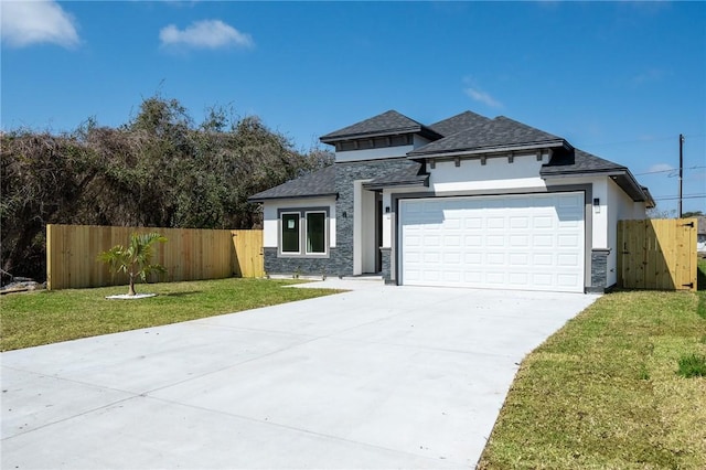 prairie-style home featuring stucco siding, fence, concrete driveway, a front yard, and a garage