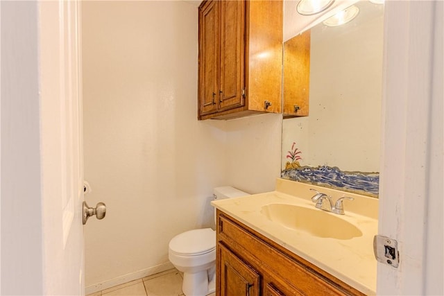 bathroom featuring tile patterned floors, vanity, and toilet