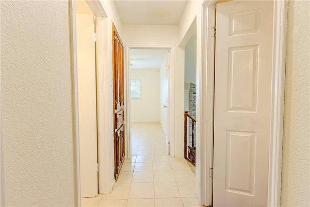 hallway featuring light tile patterned flooring