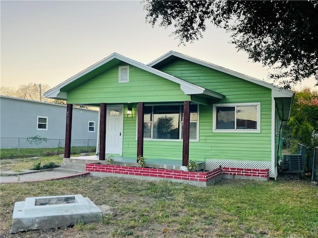 4313 Molina Dr, Corpus Christi, TX 78416 - view of front of property featuring covered porch, an outdoor fire pit, and central air condition unit
