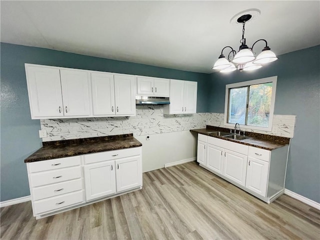 4313 Molina Dr, Corpus Christi, TX 78416 - kitchen with a sink, under cabinet range hood, and light wood finished floors
