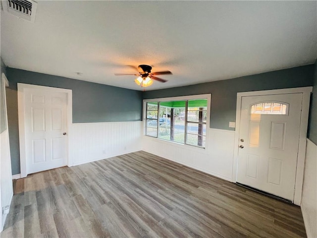 4313 Molina Dr, Corpus Christi, TX 78416 - foyer featuring a wainscoted wall, wood finished floors, and a ceiling fan