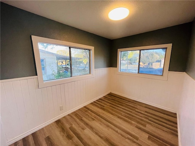 4313 Molina Dr, Corpus Christi, TX 78416 - empty room featuring wood finished floors and a wainscoted wall