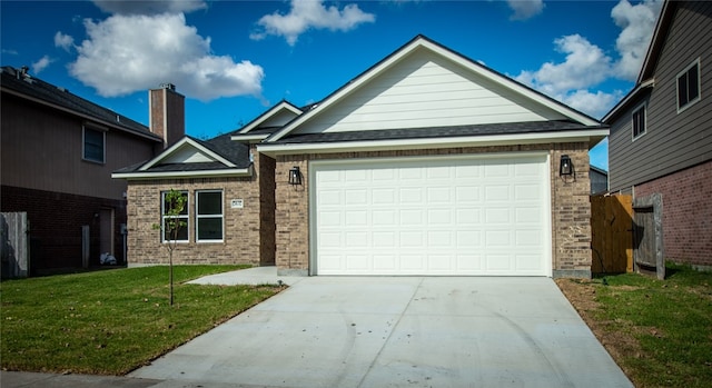 view of front facade featuring a front yard and a garage