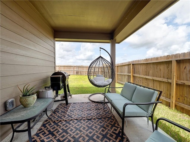 2693 Excelsior Blvd, Corpus Christi, TX 78415 - fenced backyard featuring an outdoor living space, a patio area, and area for grilling