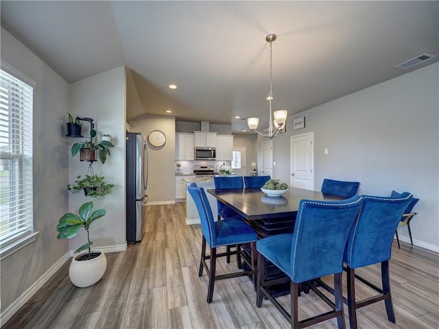 2693 Excelsior Blvd, Corpus Christi, TX 78415 - dining room featuring light wood-style floors, a chandelier, healthy amount of natural light, and recessed lighting