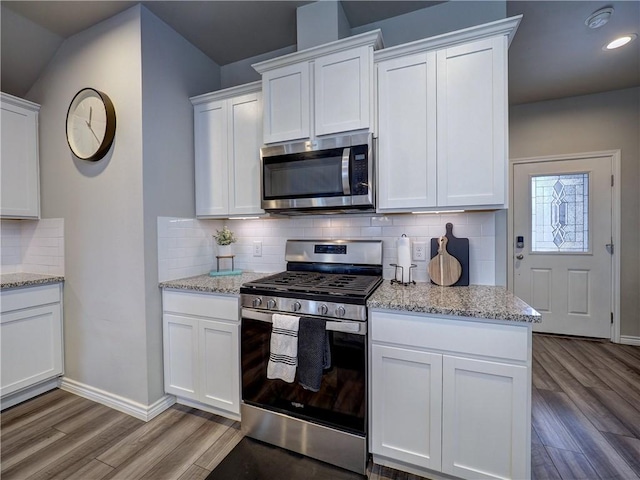 2693 Excelsior Blvd, Corpus Christi, TX 78415 - kitchen featuring appliances with stainless steel finishes, light wood-style floors, white cabinets, and recessed lighting