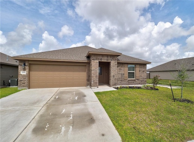 2693 Excelsior Blvd, Corpus Christi, TX 78415 - view of front of house featuring driveway, brick siding, a front lawn, an attached garage, and roof with shingles