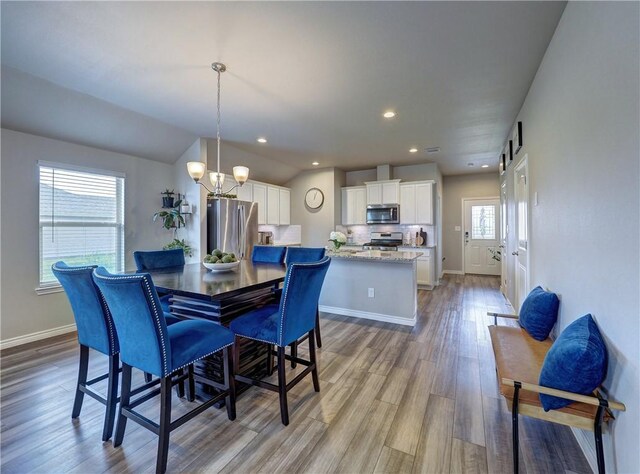 2693 Excelsior Blvd, Corpus Christi, TX 78415 - dining area with wood finished floors, a chandelier, and recessed lighting