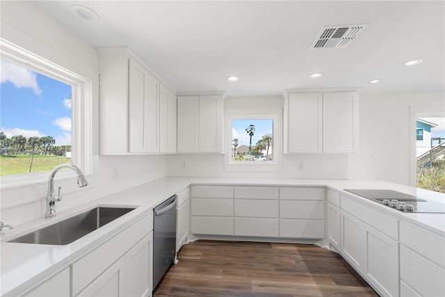 kitchen featuring black electric stovetop, white cabinetry, dark hardwood / wood-style flooring, sink, and dishwasher