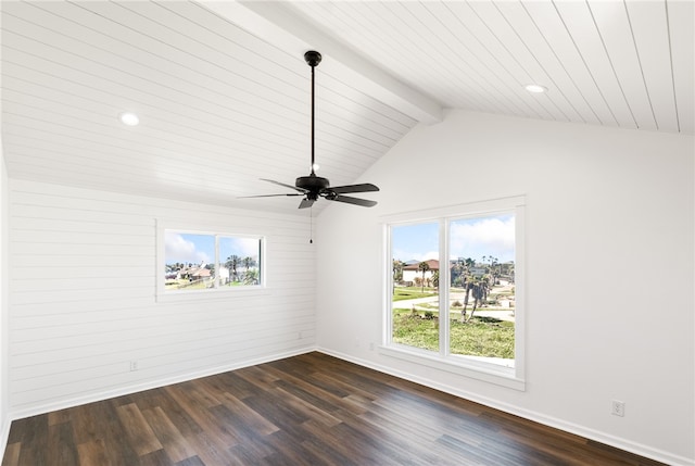 empty room featuring ceiling fan, dark hardwood / wood-style floors, and lofted ceiling with beams