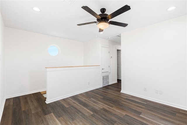 empty room with dark wood-type flooring and ceiling fan