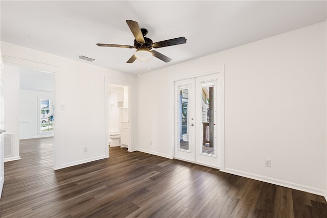 unfurnished room with ceiling fan and dark hardwood / wood-style floors