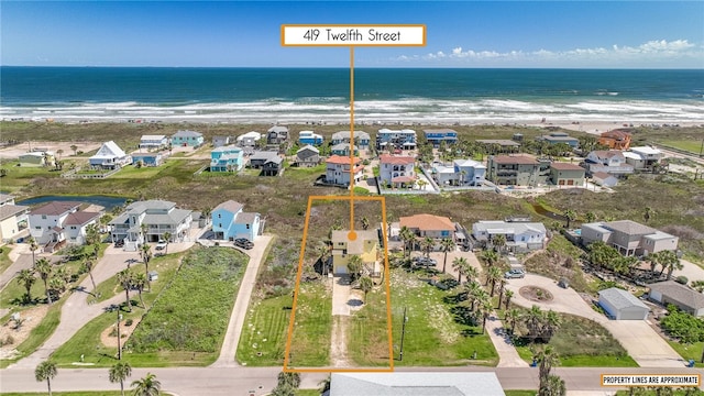 aerial view with a view of the beach and a water view