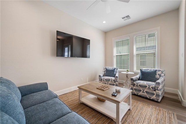 living room with wood finished floors, ceiling fan, baseboards, visible vents, and recessed lighting