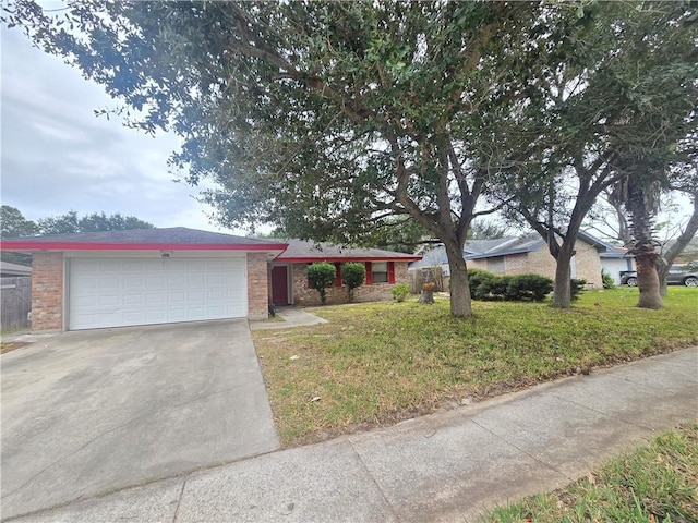 single story home with brick siding, driveway, an attached garage, and a front yard