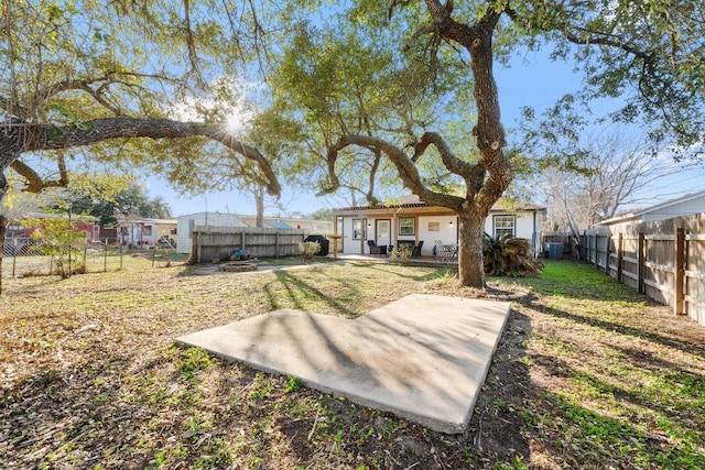 view of yard with a fenced backyard