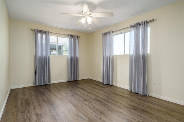 1576 Vineyard, Ingleside, TX 78362 - spare room with baseboards, wood finished floors, and a ceiling fan