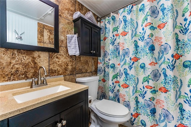 3938 Surfside Blvd Unit 2244, Corpus Christi, TX 78402 - full bathroom featuring tile walls, toilet, vanity, and a shower with curtain