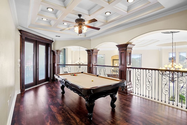 game room with a wealth of natural light, dark wood-type flooring, coffered ceiling, and ornamental molding