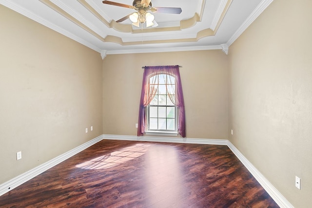 unfurnished room featuring ceiling fan, wood-type flooring, crown molding, and a tray ceiling