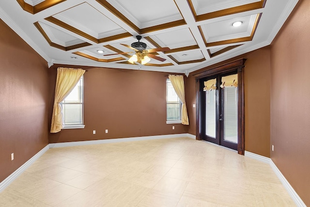 spare room featuring french doors, ornamental molding, coffered ceiling, ceiling fan, and beamed ceiling