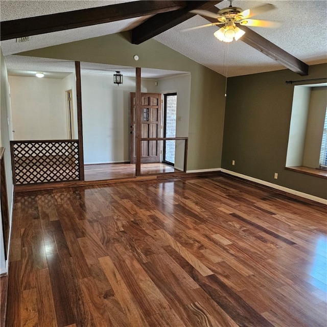 spare room featuring a textured ceiling, vaulted ceiling with beams, hardwood / wood-style flooring, and ceiling fan