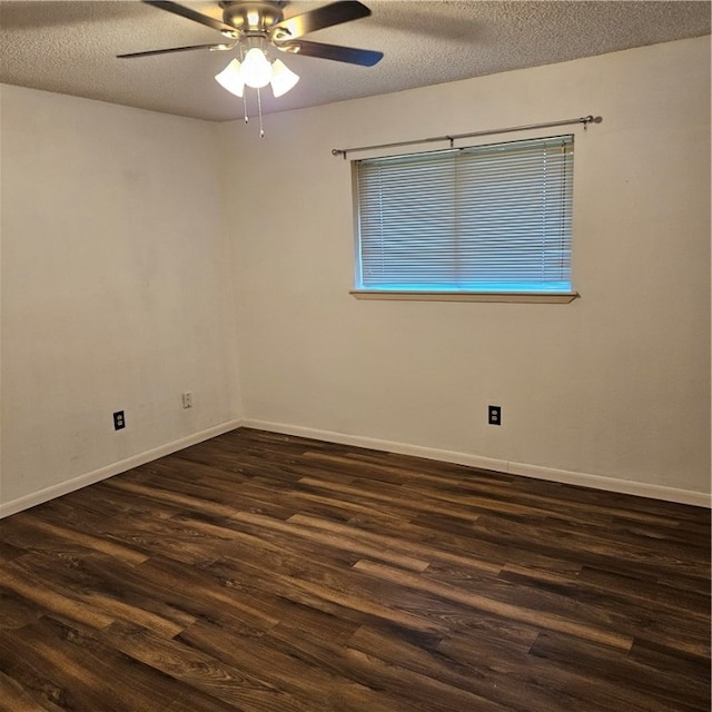 empty room with dark wood-type flooring, a textured ceiling, and ceiling fan