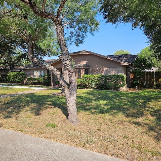 ranch-style house with a front yard