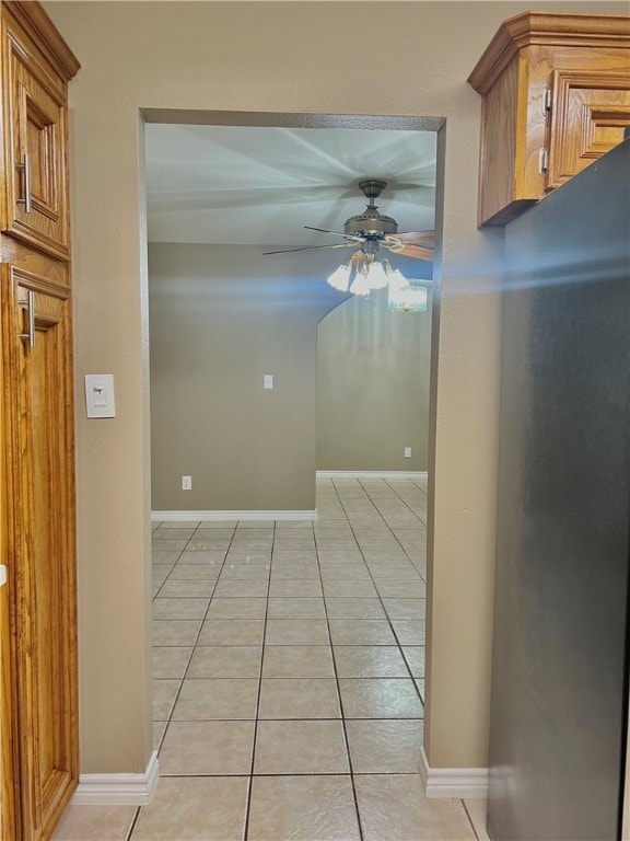 corridor with light tile patterned flooring