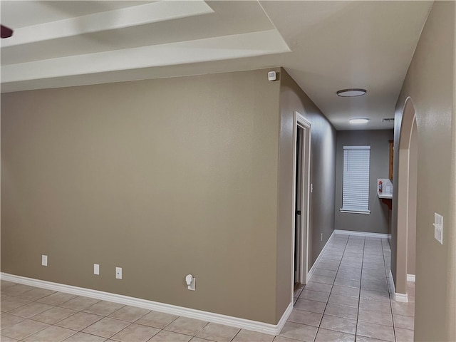 hallway with light tile patterned floors